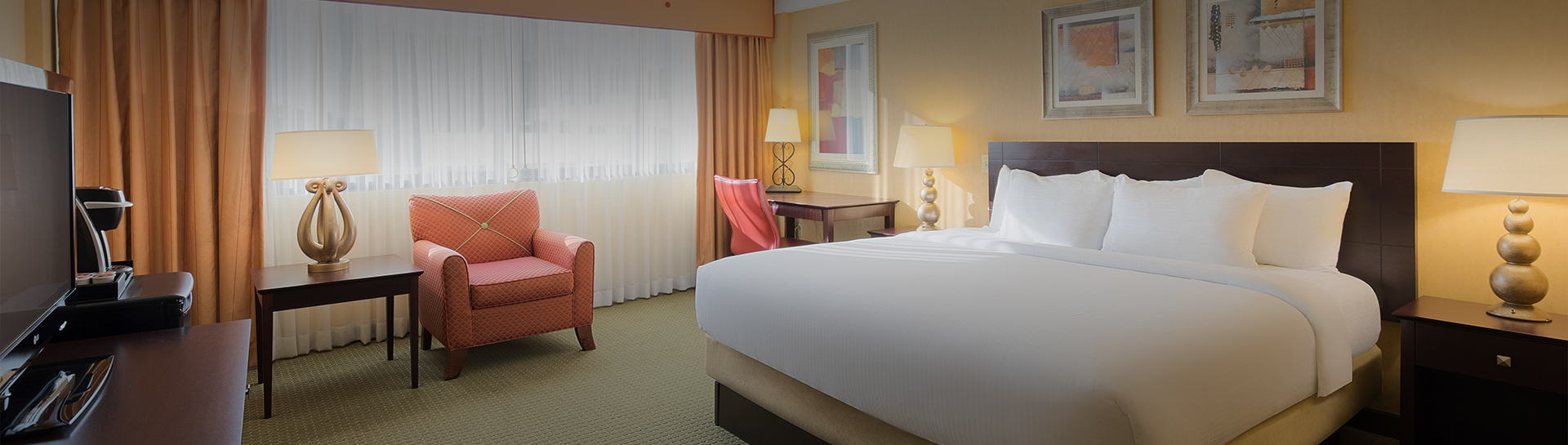 a hotel room with a bed and a chair