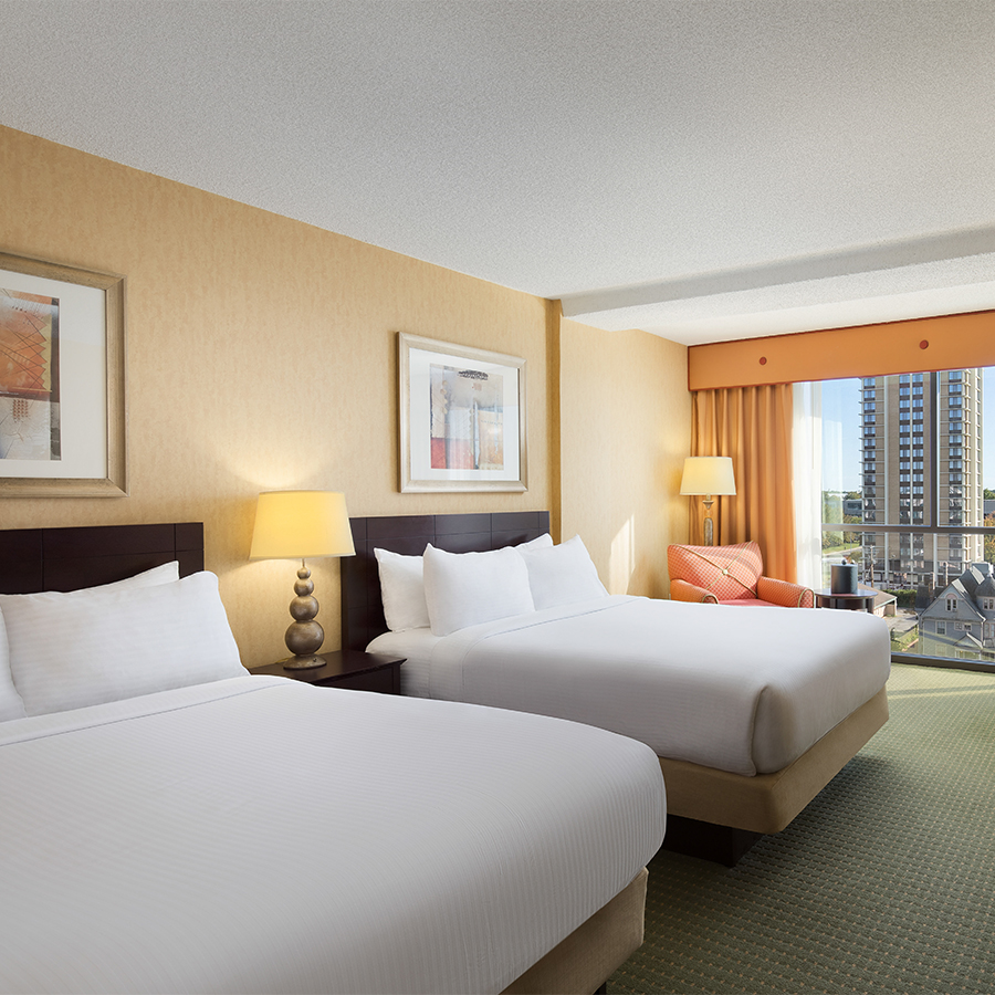 a hotel room with two beds