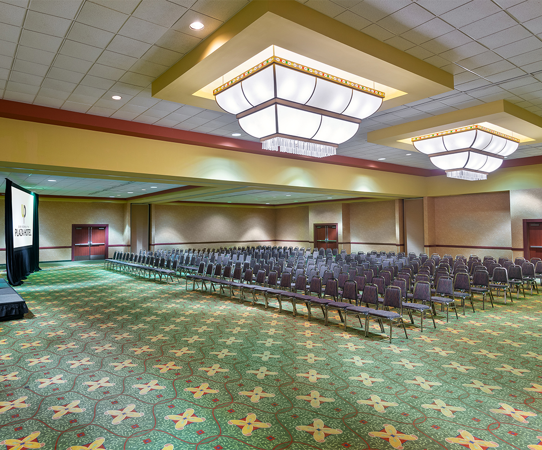 a room with chairs and a chandelier