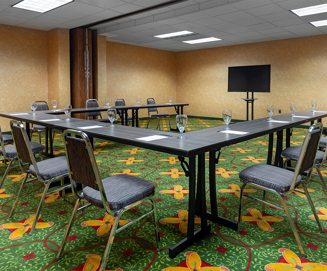 a room with a table and chairs