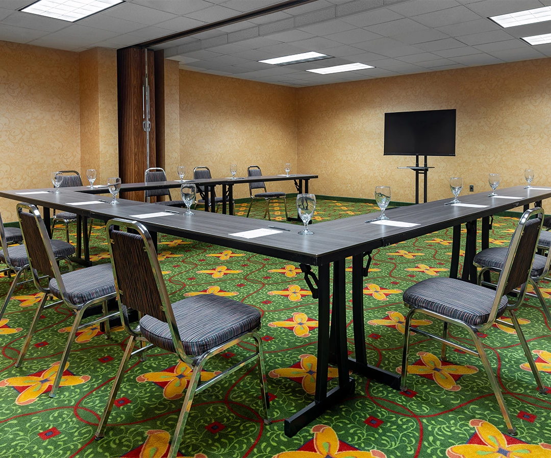 a room with a table and chairs