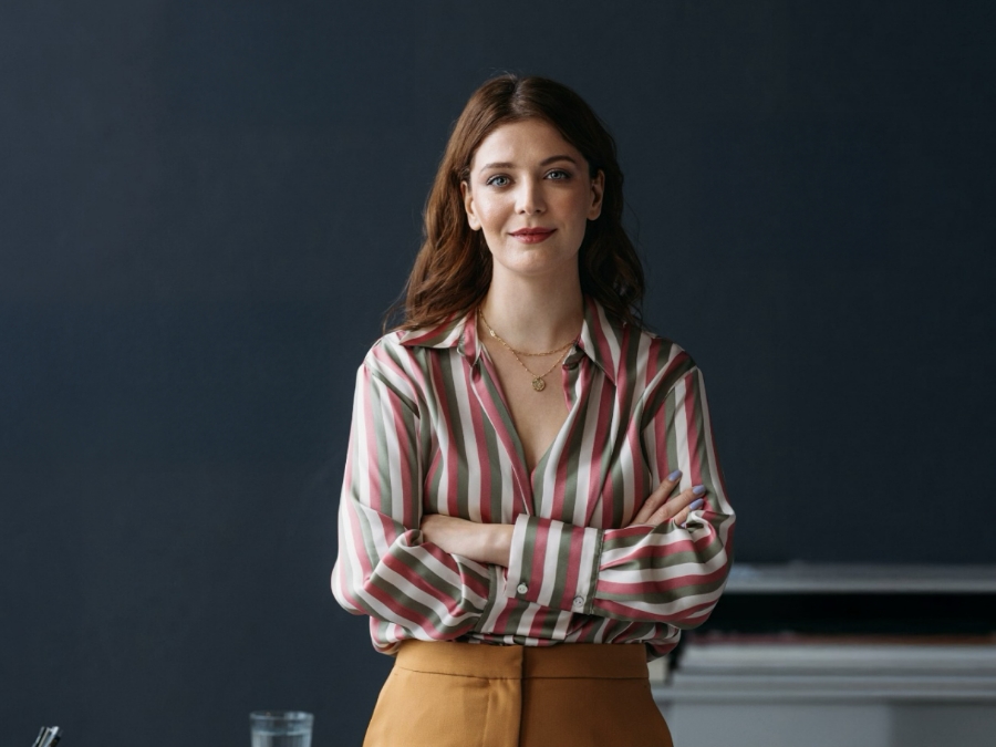 a woman with her arms crossed