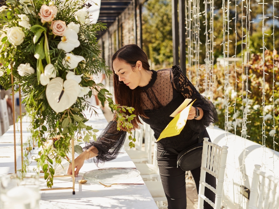 a woman standing at a table