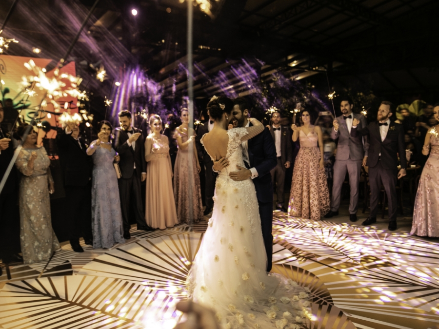 a man and woman in a wedding dress dancing