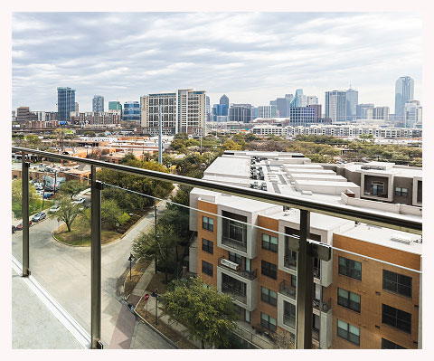 a city skyline seen from a balcony