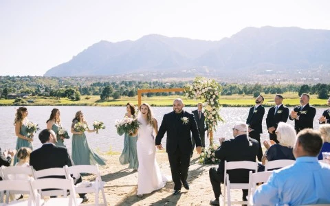 a group of people walking down the aisle