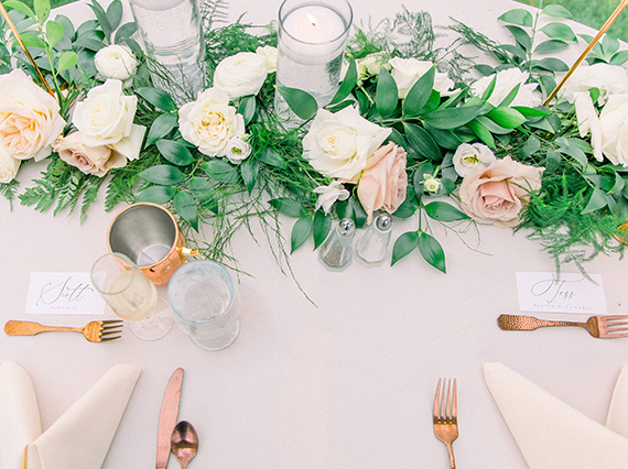 a table with flowers and candles