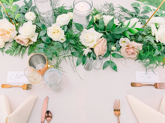 a table with flowers and candles