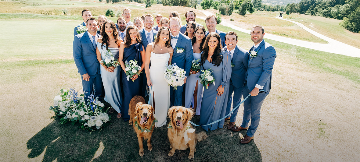 a group of people posing for a photo with a dog