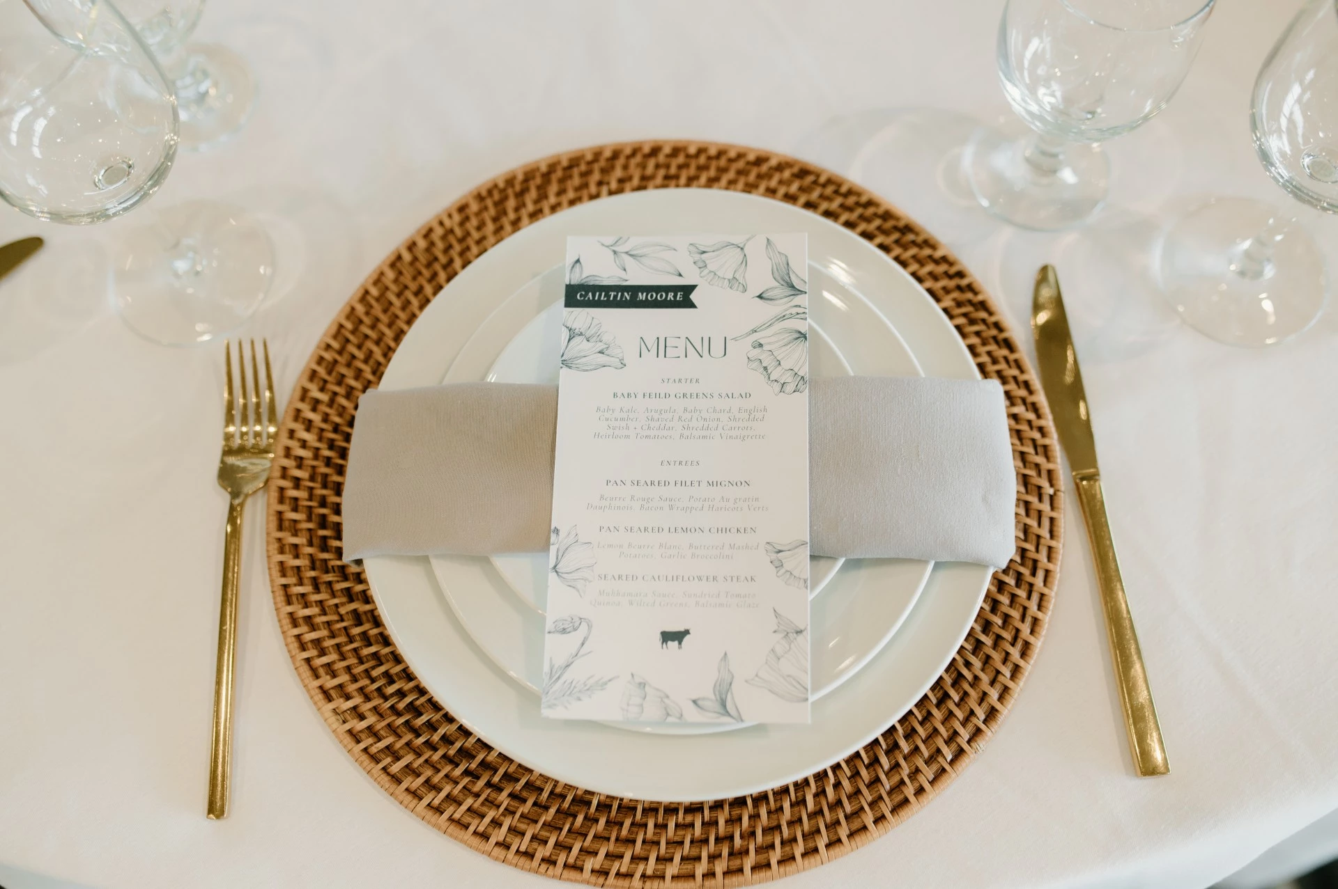 a place setting with a menu on a plate