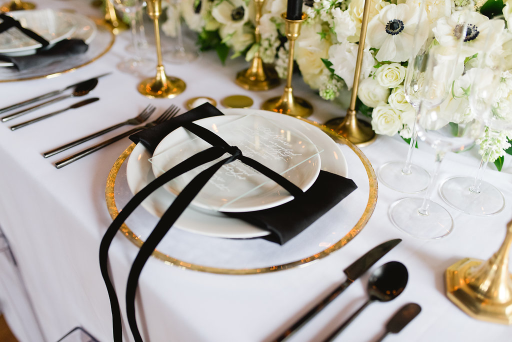 a table set with plates and silverware
