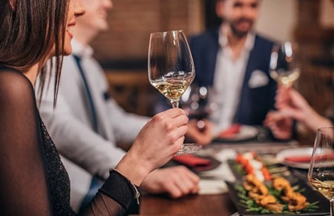 a woman holding a wine glass