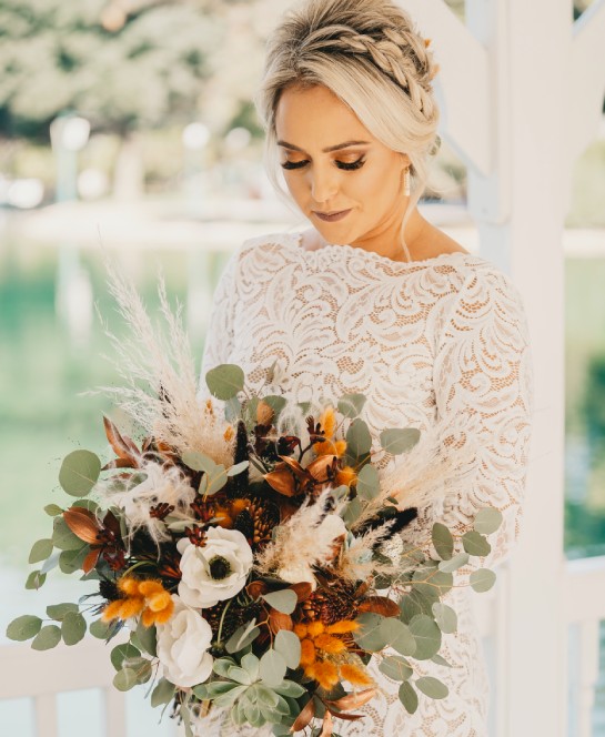 a woman holding a bouquet of flowers