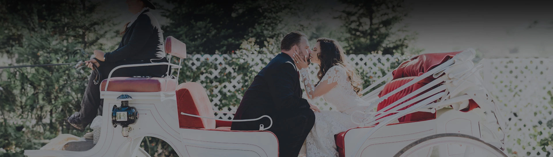 a man and woman kissing in a carriage