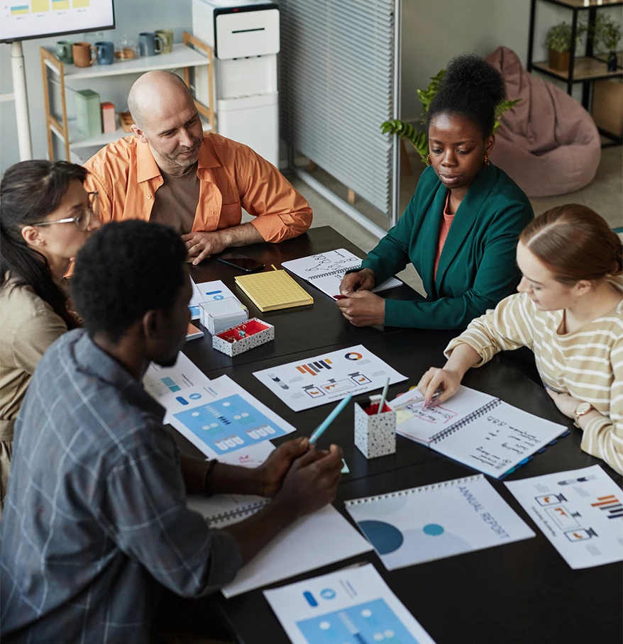 a group of people sitting around a table