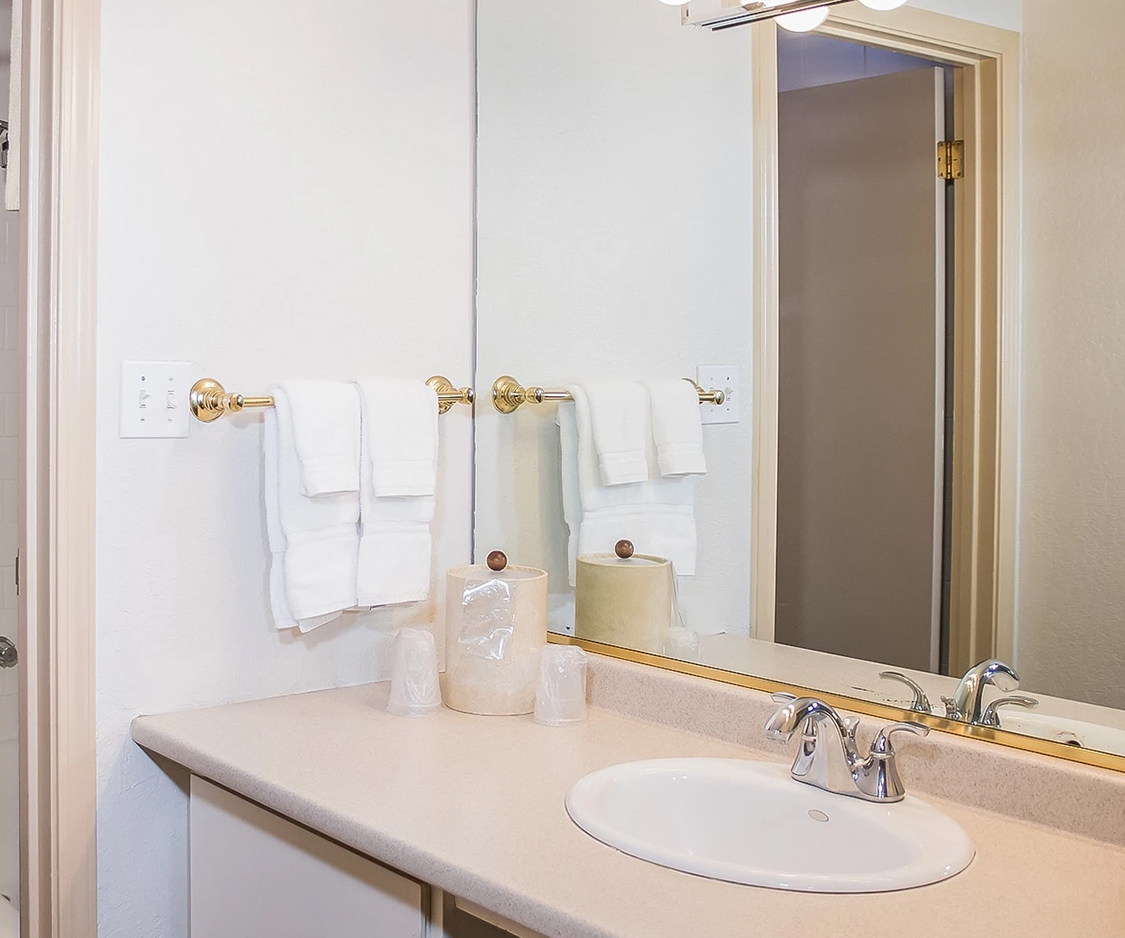 a bathroom with a mirror and sink