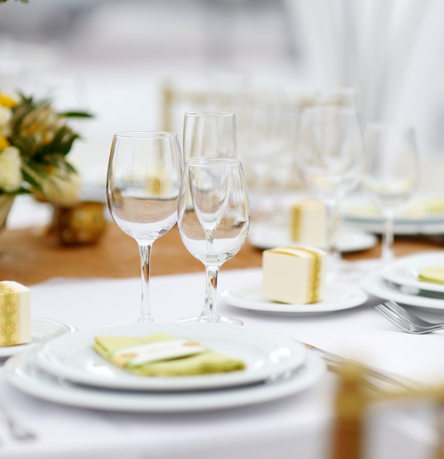 a table set with plates and glasses