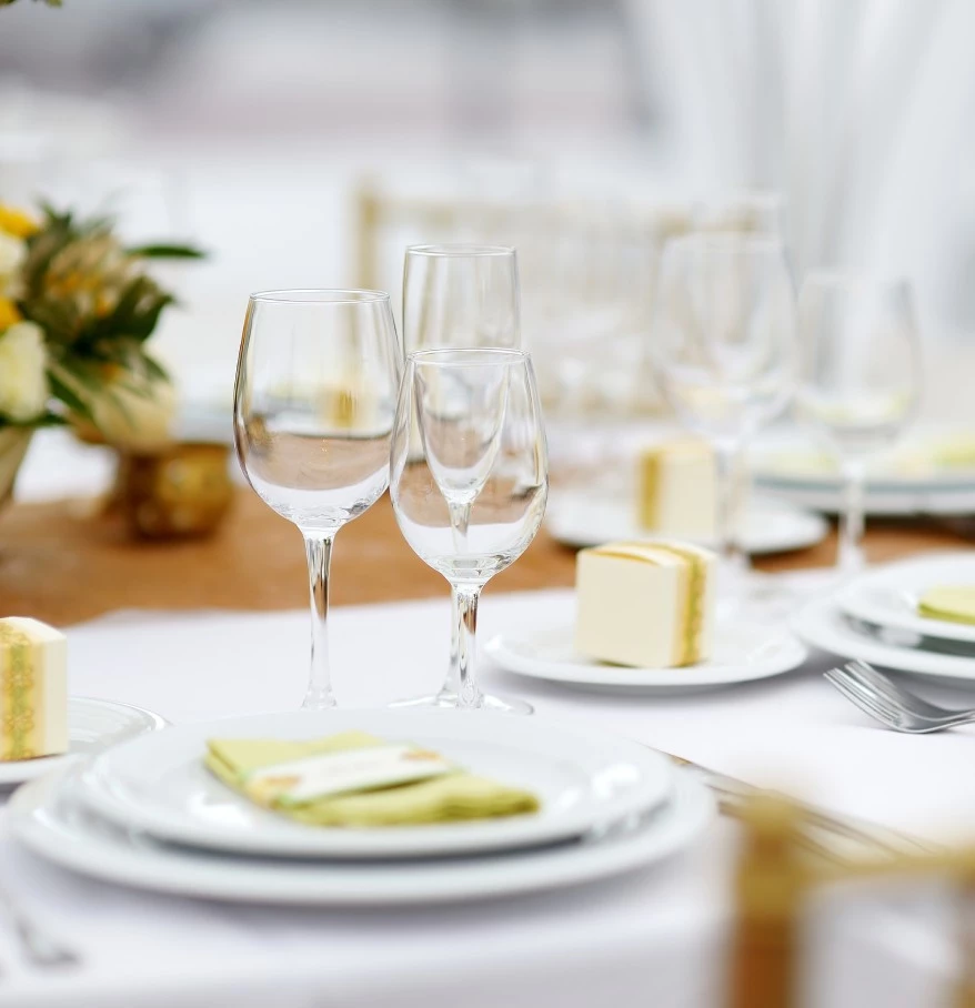 a table set with plates and glasses