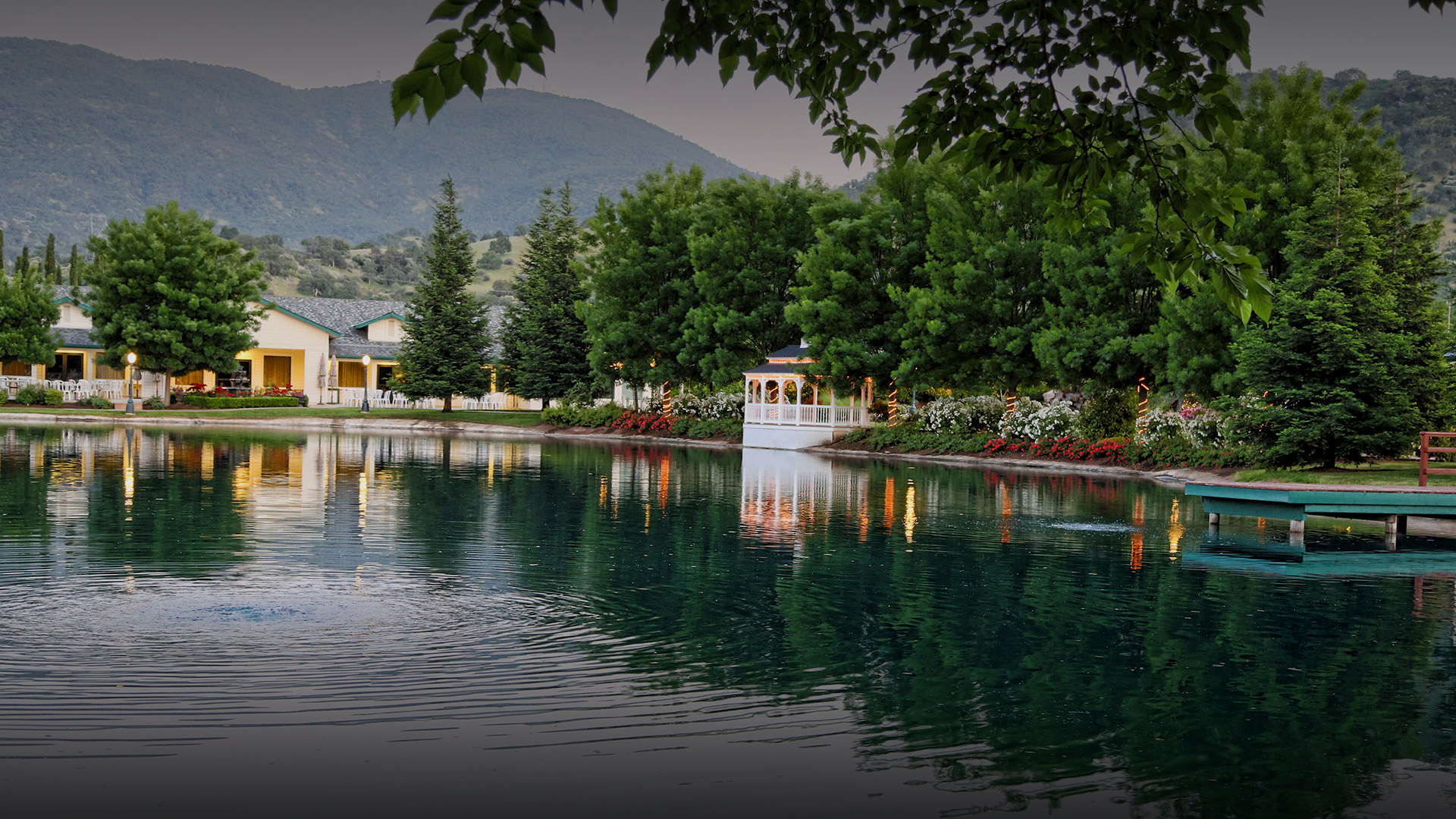 a lake with a house and trees
