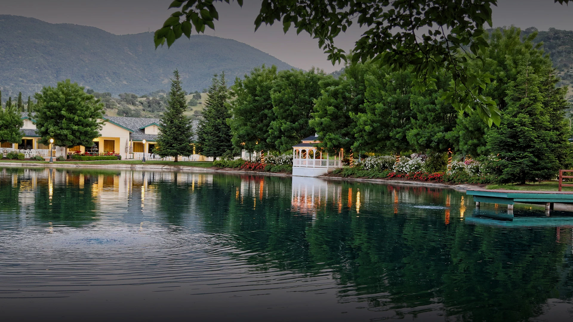 a lake with a house and trees