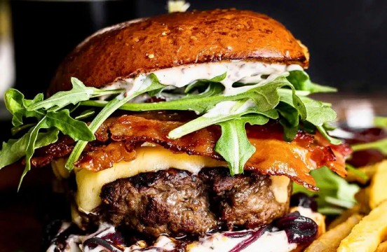 a burger with bacon and cheese