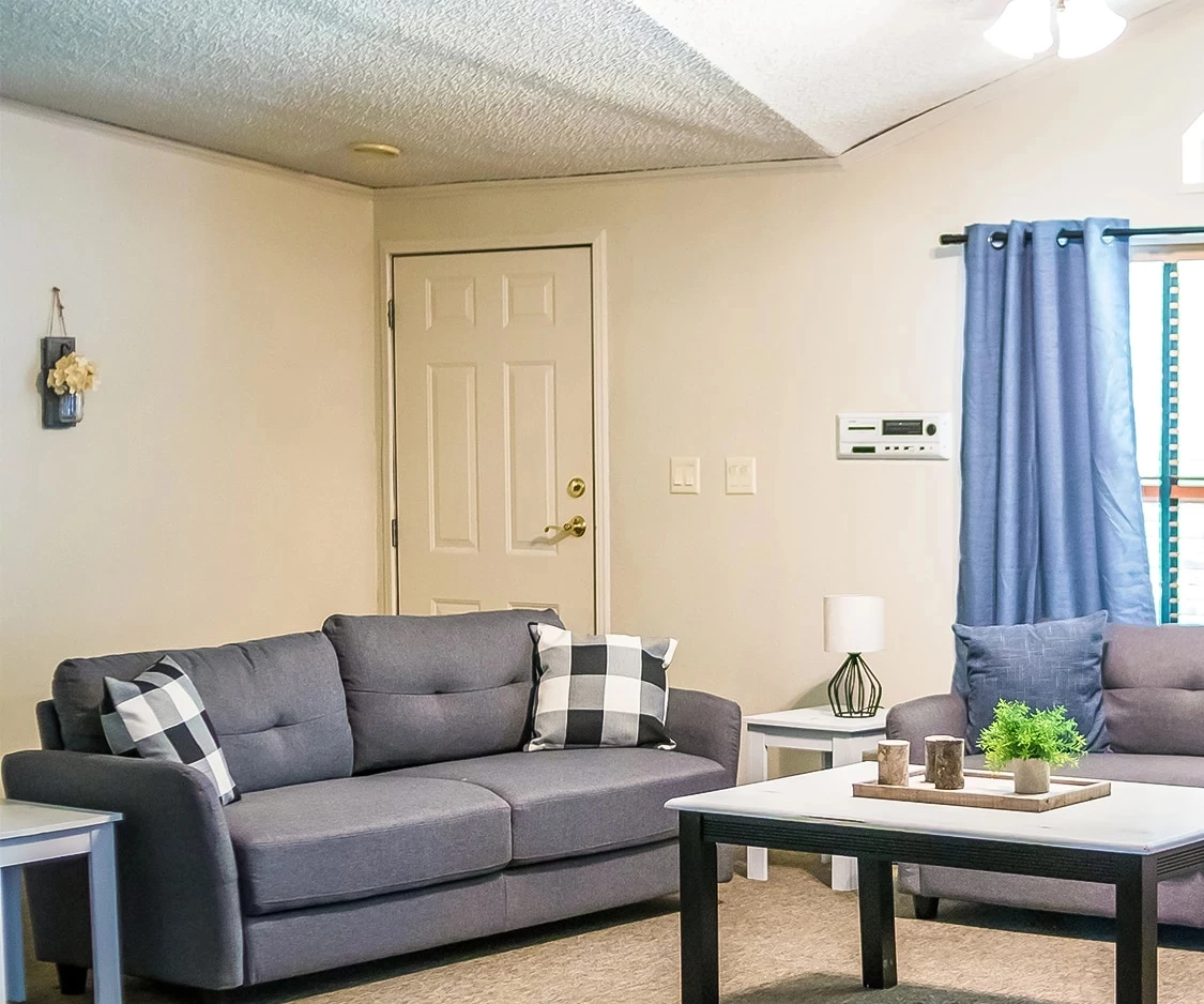 a living room with a couch and coffee table