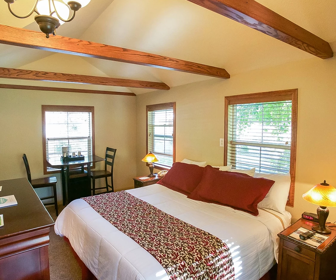 a bedroom with a bed and a desk